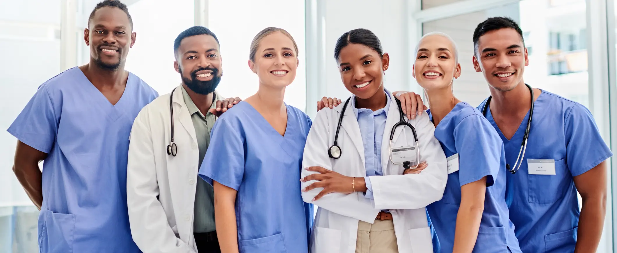 a group of medical professionals smiling at the camera