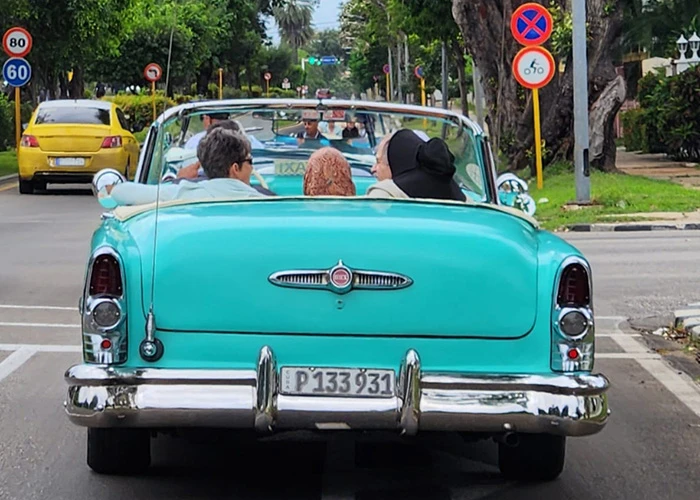 Travellers in a classic car