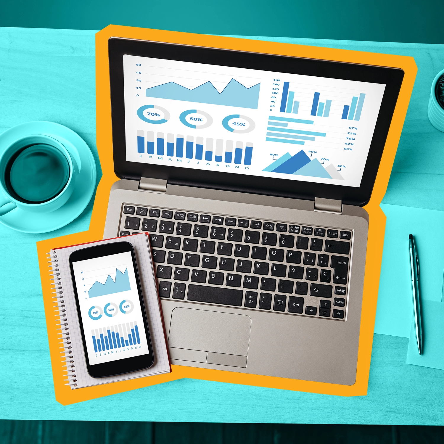 computer and phone showing graphs and data dashboards.