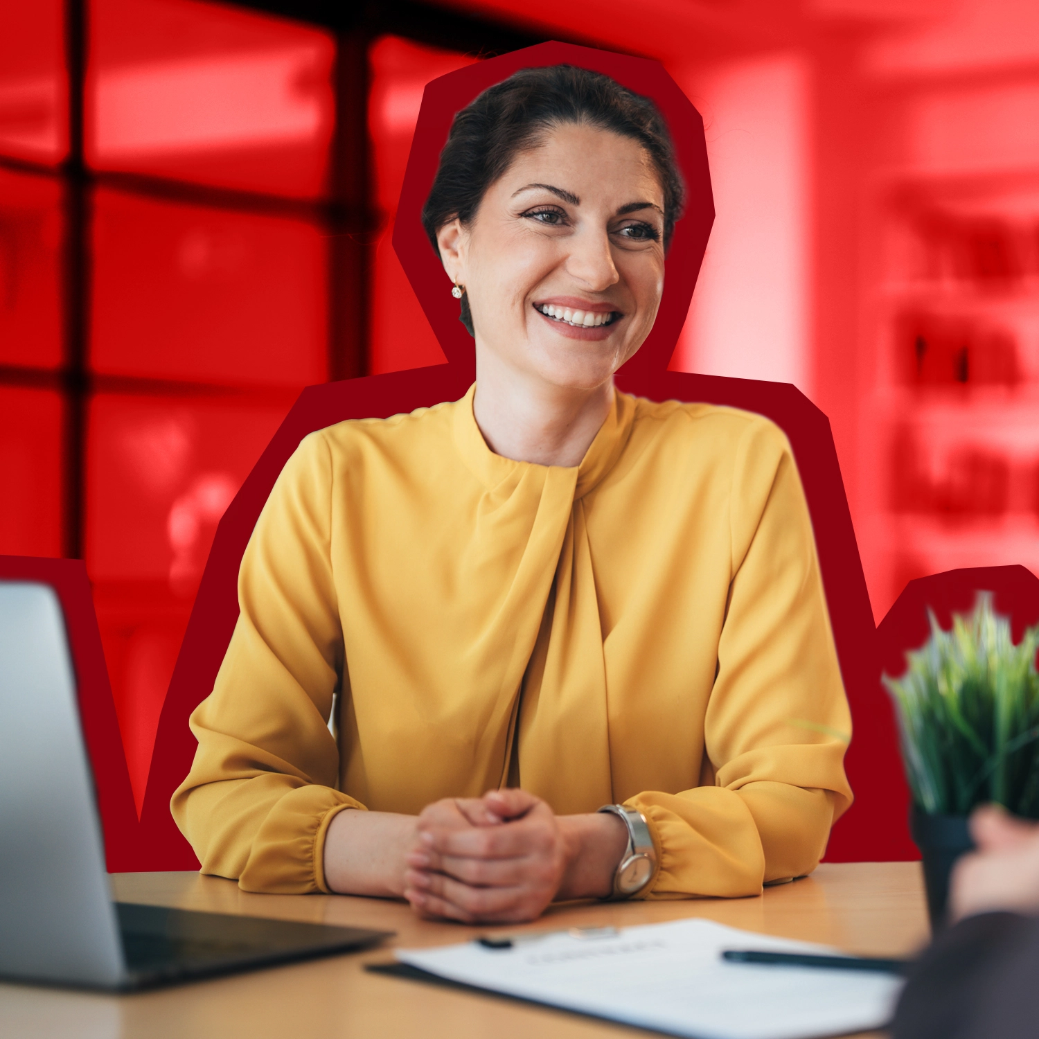 a woman smiling at someone offcamera.